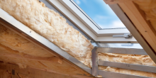 skylight window in attic roof showing insulation, before finishing touches